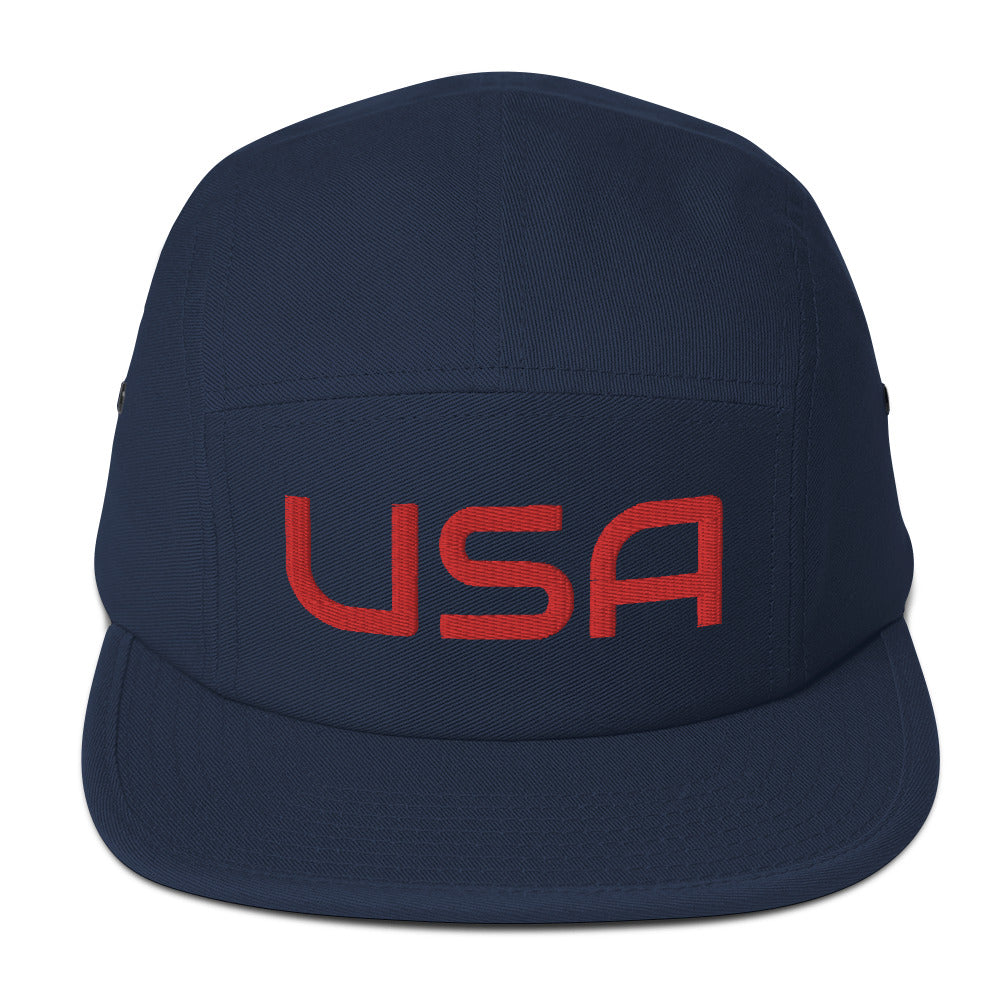 USA Camp HatHatUSA Camp HatThis camper style cap has a low profile and nylon strap clip closure. Comfortable and classic! • 100% cotton • Soft-structured • Five panel • Low profile • Metal eyelets • Nylon strap clip closure This product is made especially